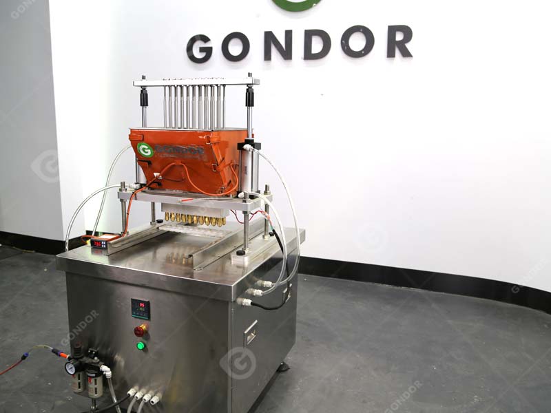 vertical candy depositor machine for gourmet candy