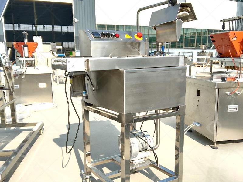 Advanced enrobing equipment for gourmet chocolate production