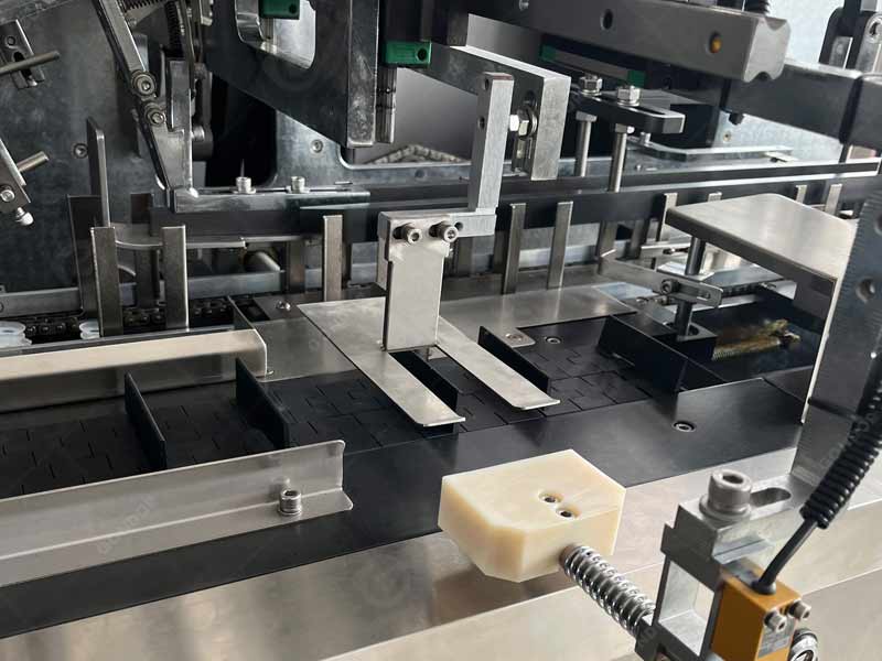 Cartoning machine for the electronics product packaging market