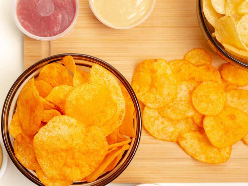 Potato peeling, cutting, and frying integrated processing line