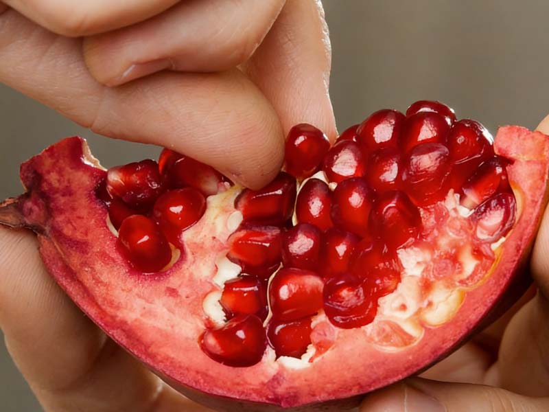 Picking the Seeds out of a Pomegranate by Hand